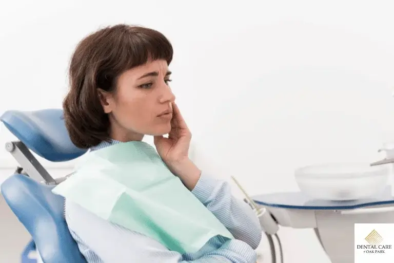 Woman touching cheek concerned about wisdom tooth recovery