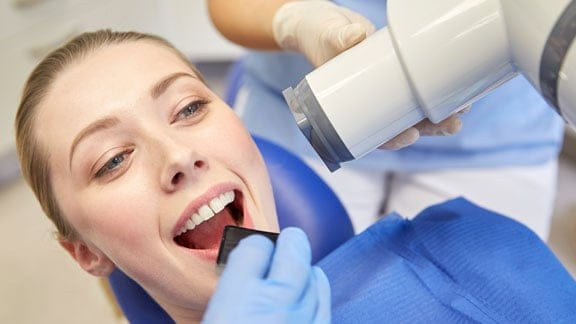 Patient undergoing a digital dental X-ray at Dental Care of Oak Park