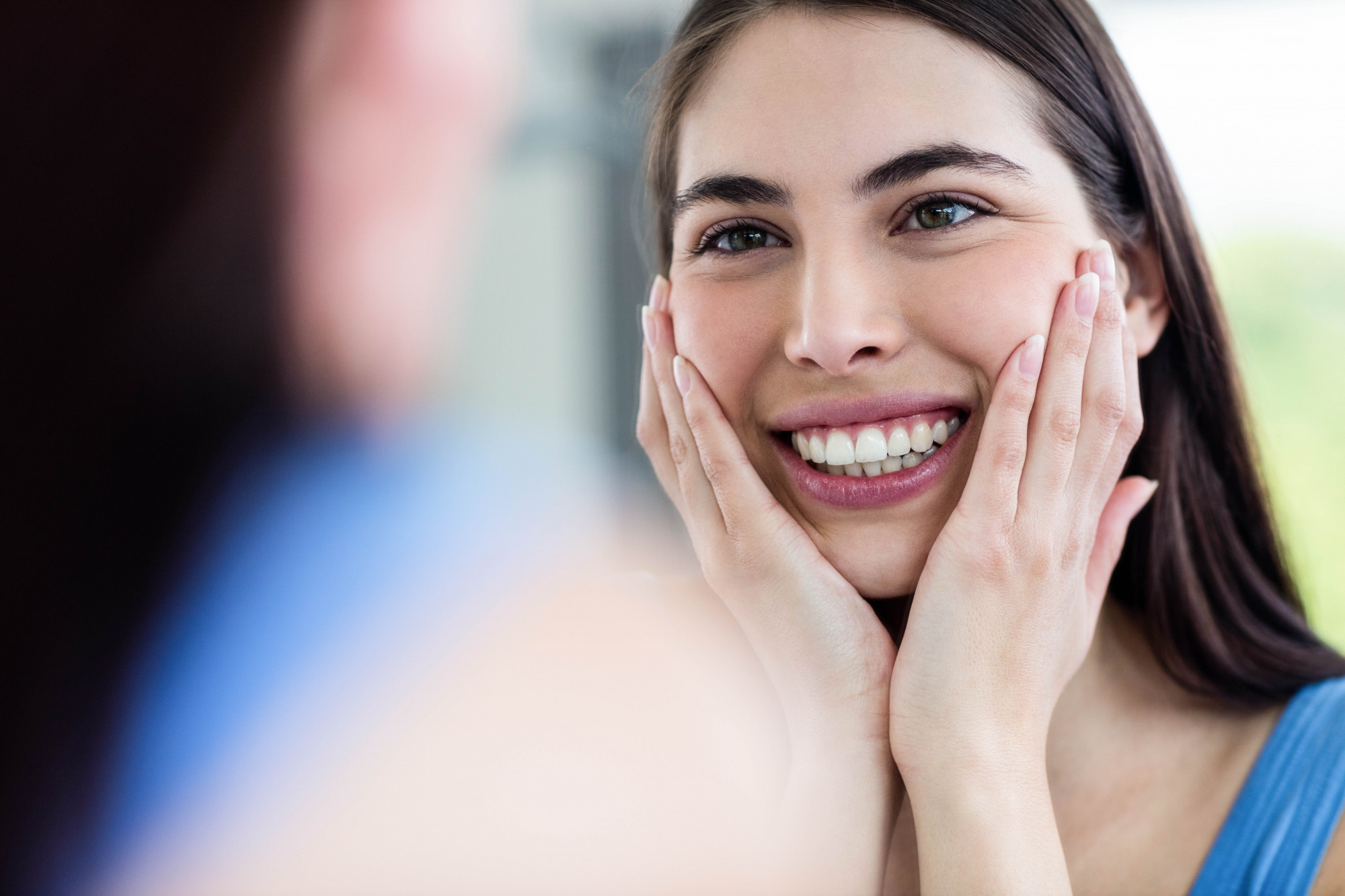 woman touching her face
